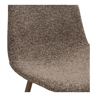 Detalje med Stockholm spisebordsstol i lysebrun bouclé fra House Nordic.