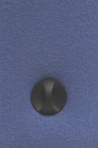 Justeringsknap på ryggen set tæt på.