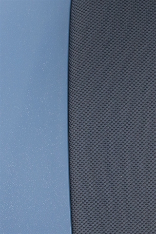 Stof og plastik på sædet set tæt på.