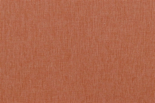Det lyse orange stof set tæt på.